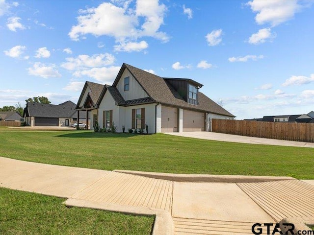 12237 Harlon St, Flint, TX 75762 - rear view of property with a yard, fence, an attached garage, and concrete driveway