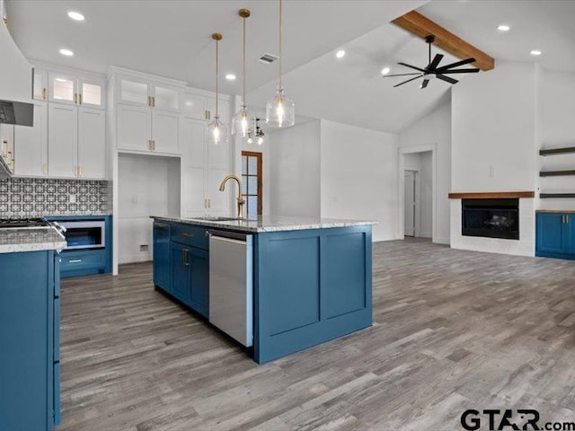 12237 Harlon St, Flint, TX 75762 - kitchen with a sink, dishwasher, ceiling fan, open floor plan, and blue cabinetry