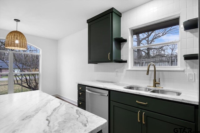 kitchen with a healthy amount of sunlight, dishwasher, sink, and light stone countertops