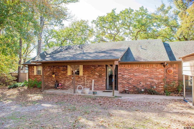 rear view of property with a patio area