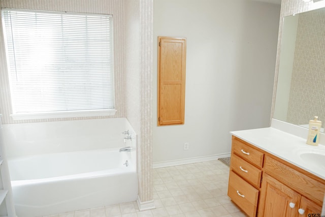 bathroom with a bathing tub and vanity