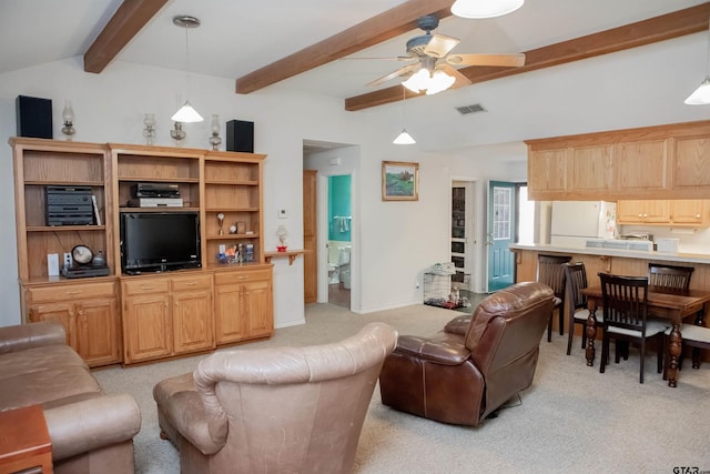 carpeted living room featuring lofted ceiling with beams and ceiling fan