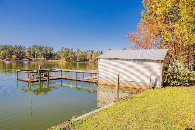 dock area featuring a yard and a water view