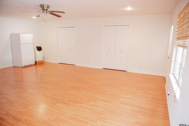 unfurnished room featuring ceiling fan and light hardwood / wood-style floors