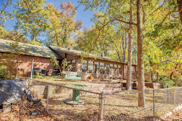 exterior space featuring a sunroom