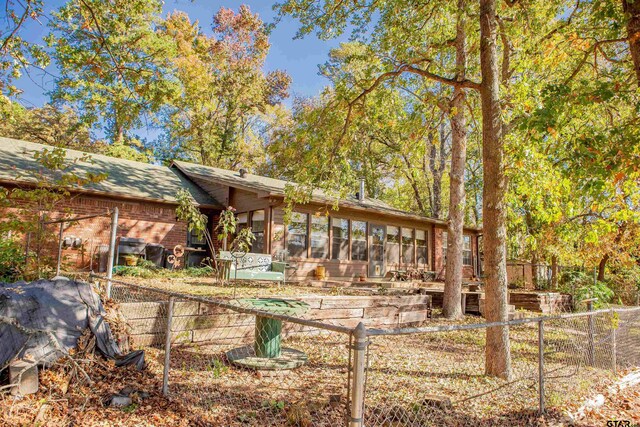 exterior space featuring a sunroom