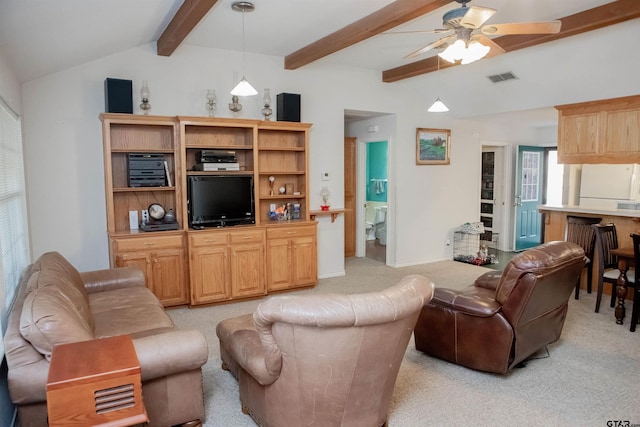 carpeted living room featuring ceiling fan and vaulted ceiling with beams