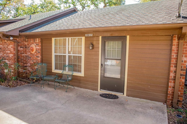 entrance to property with a patio