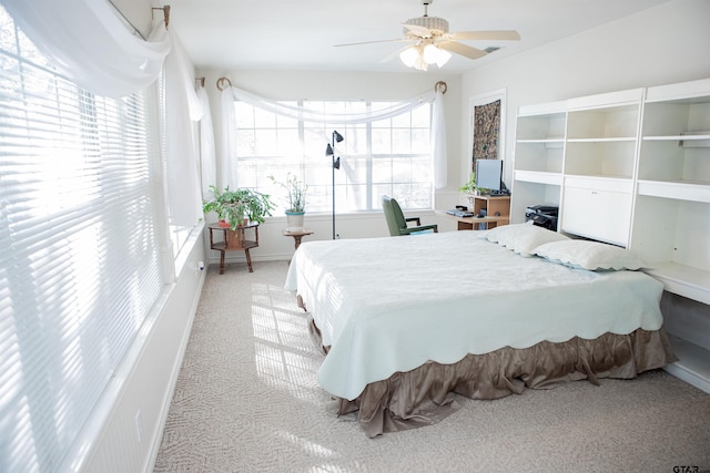 bedroom with light colored carpet and ceiling fan