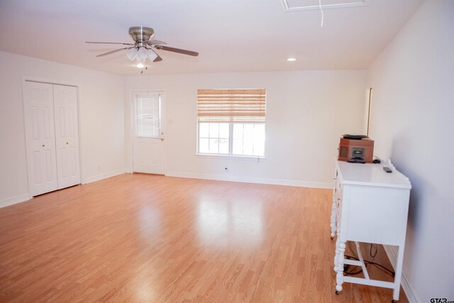 empty room featuring light hardwood / wood-style flooring and ceiling fan