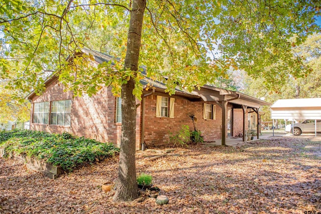 view of front of property featuring a carport