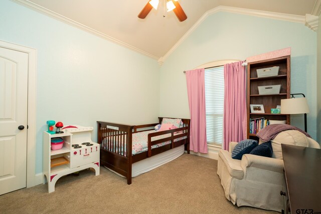 carpeted bedroom with multiple windows, vaulted ceiling, a nursery area, and ceiling fan