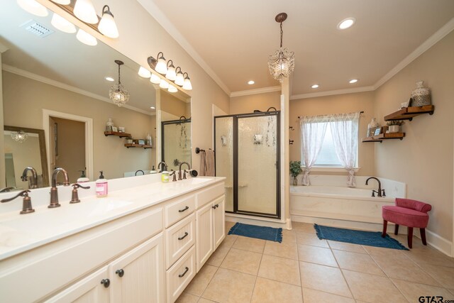 bathroom with tile patterned floors, separate shower and tub, a notable chandelier, ornamental molding, and vanity