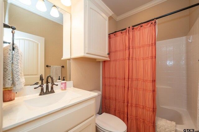 full bathroom featuring toilet, vanity, shower / bath combination with curtain, and crown molding