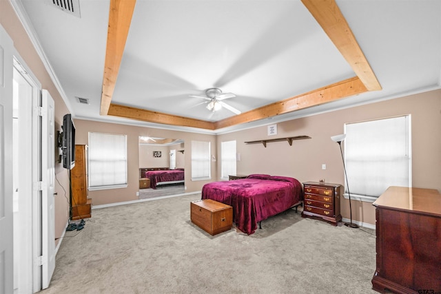 bedroom with a tray ceiling, crown molding, ceiling fan, and carpet floors