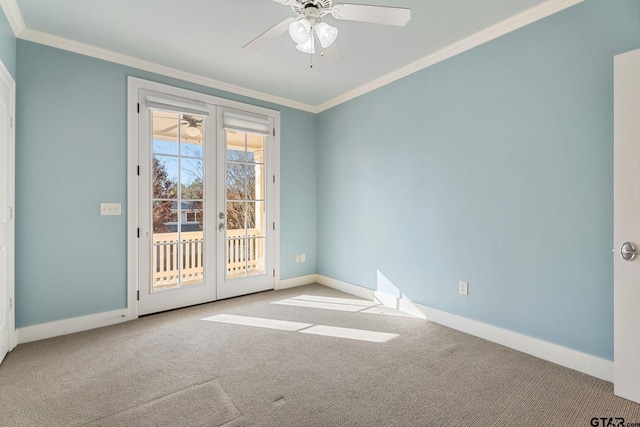 carpeted empty room with ceiling fan and crown molding