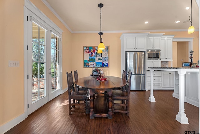 dining space with crown molding and dark hardwood / wood-style floors