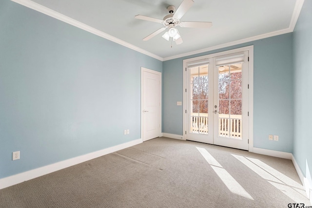 spare room featuring ceiling fan, light colored carpet, crown molding, and french doors