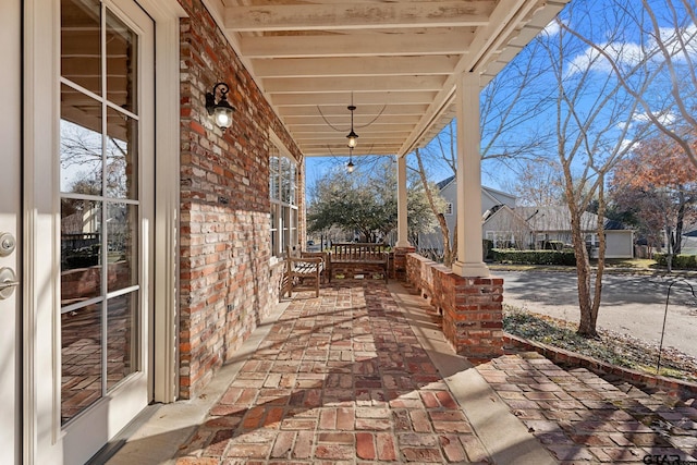 view of patio featuring a porch