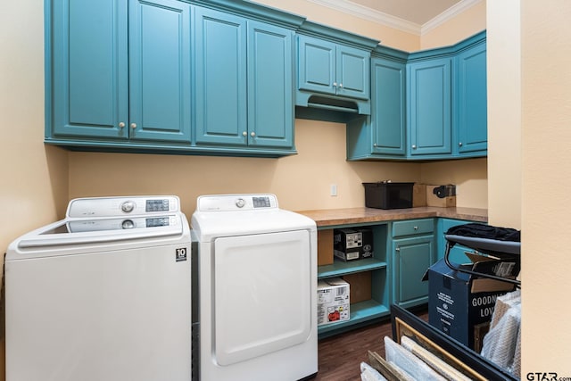 laundry room with cabinets, ornamental molding, dark wood-type flooring, and separate washer and dryer