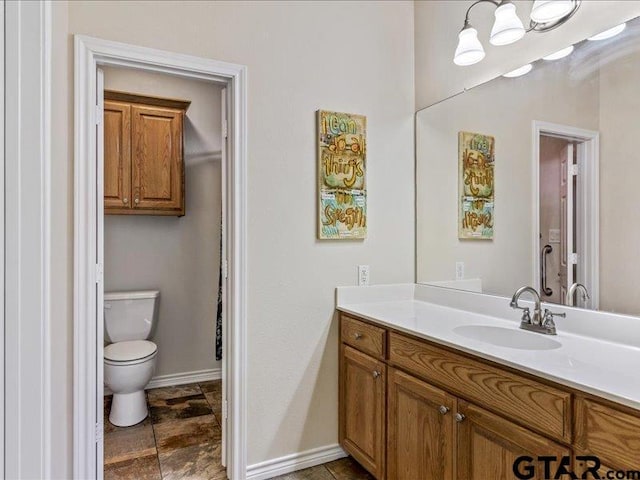 bathroom with vanity and toilet