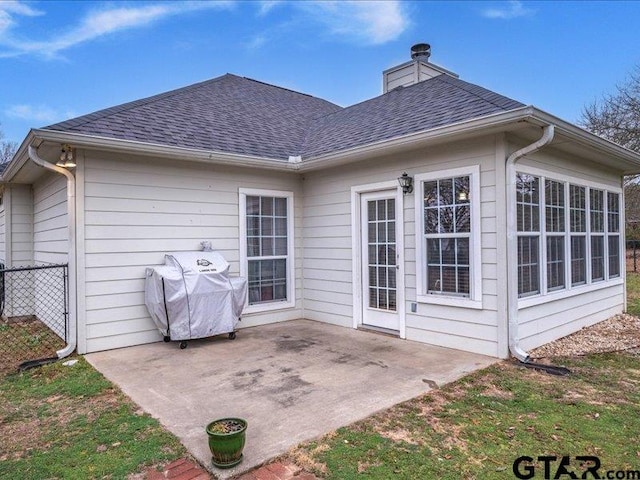 rear view of house featuring a patio