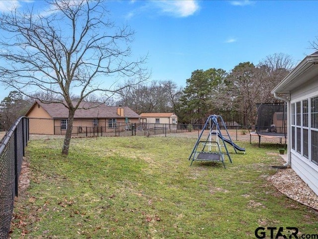 view of yard with a trampoline