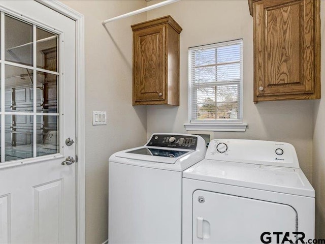 laundry area with cabinets and washer and dryer