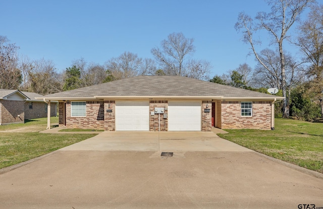 single story home featuring a garage and a front lawn