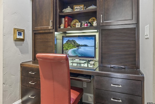 home office featuring a textured wall