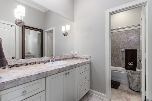 full bath with vanity, ornamental molding, and shower / bathing tub combination