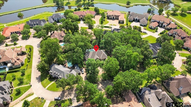 bird's eye view with a residential view and a water view