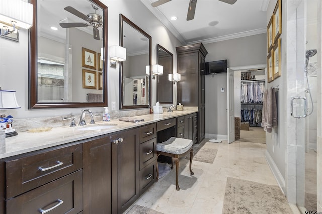 full bathroom with a sink, ceiling fan, ornamental molding, and double vanity