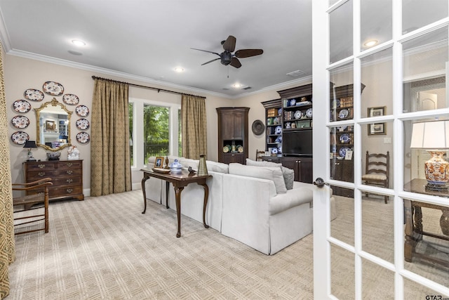 living area featuring ornamental molding, a ceiling fan, recessed lighting, and light colored carpet