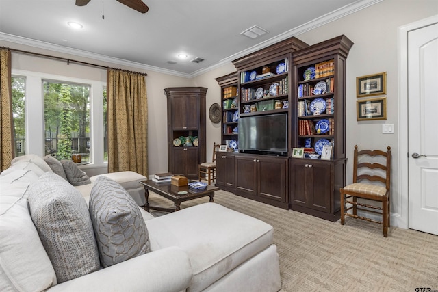 living room featuring a ceiling fan, visible vents, light carpet, and ornamental molding