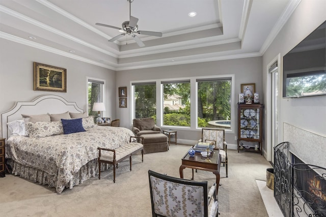 bedroom with crown molding, light carpet, baseboards, a raised ceiling, and a ceiling fan
