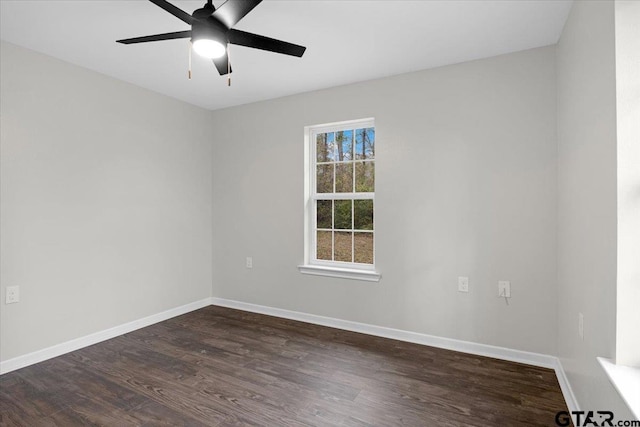 spare room featuring ceiling fan and dark hardwood / wood-style flooring