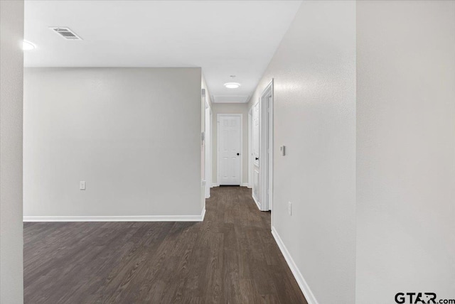 hall with dark hardwood / wood-style flooring