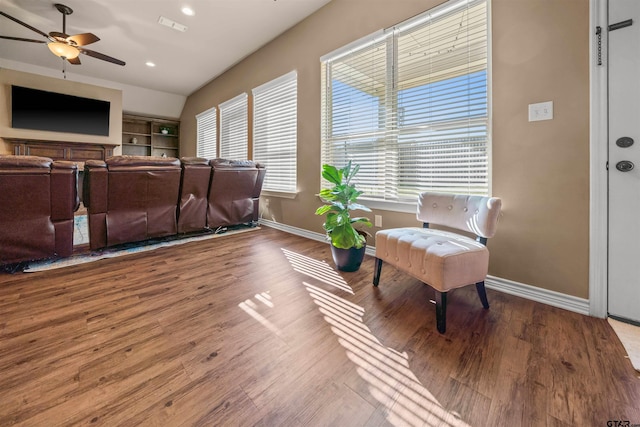 living area featuring visible vents, baseboards, recessed lighting, wood finished floors, and a ceiling fan