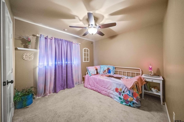 carpeted bedroom with a ceiling fan