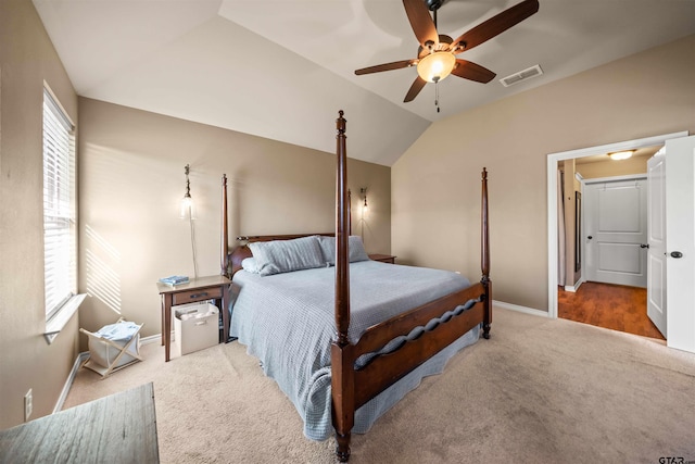 bedroom with visible vents, a ceiling fan, carpet, baseboards, and vaulted ceiling