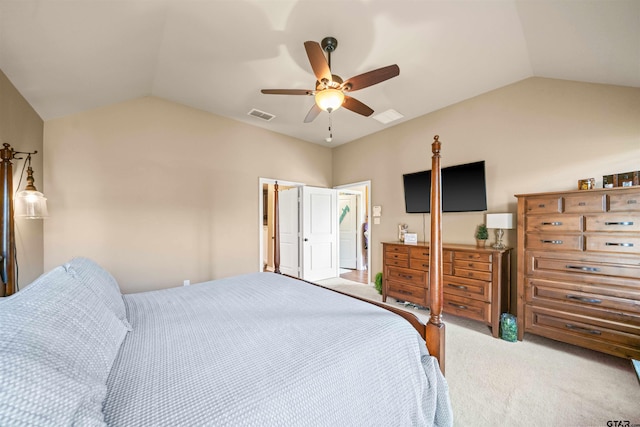 bedroom with vaulted ceiling, carpet flooring, visible vents, and ceiling fan