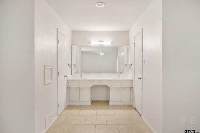 bathroom featuring tile patterned flooring and vanity