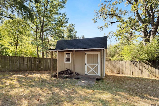 view of shed with a fenced backyard
