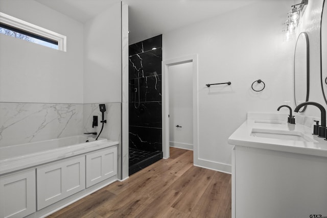 bathroom featuring vanity, independent shower and bath, and hardwood / wood-style flooring