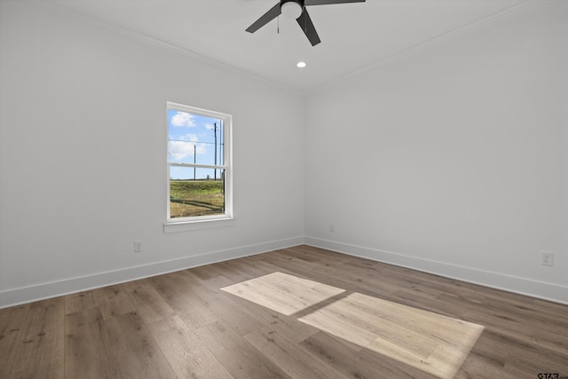 unfurnished room with hardwood / wood-style flooring, ceiling fan, and ornamental molding