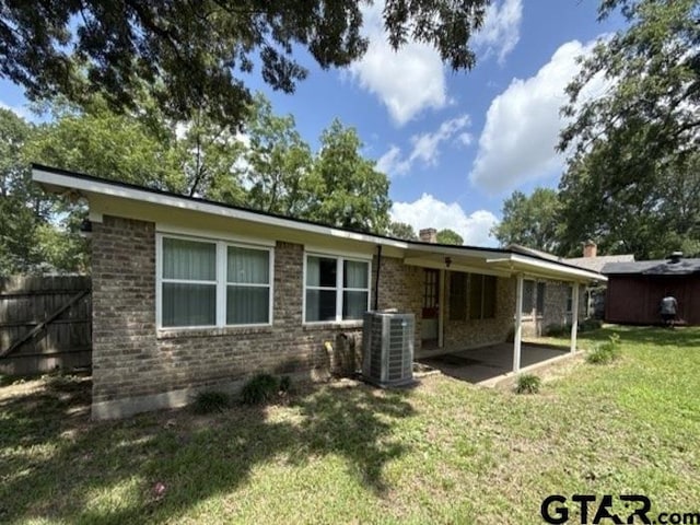 3606 Glendale Dr, Tyler, TX 75701 - rear view of house with a patio and brick siding