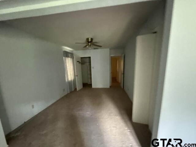 3606 Glendale Dr, Tyler, TX 75701 - unfurnished living room featuring ceiling fan and concrete flooring