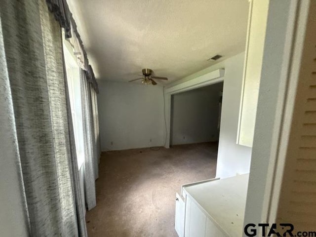 3606 Glendale Dr, Tyler, TX 75701 - carpeted spare room with ceiling fan and a textured ceiling