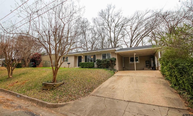 ranch-style home featuring a front yard and a carport